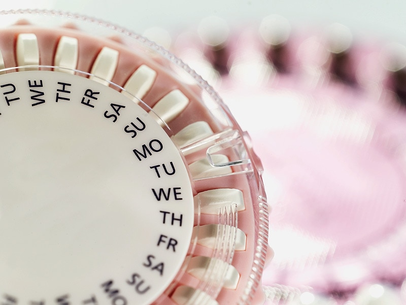 Why do certain hormonal contraceptives increase the risk of HIV