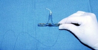 The needle is placed vertically and longitudinally