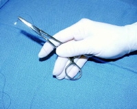 The needle holder is held in the palm, allowing gr