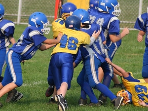Educate Kids to Curb Football Injuries, Says AAP